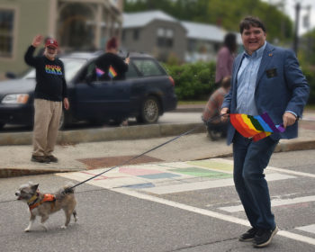 Sen. Chip Curry in the Pride Parade with his dog Marty