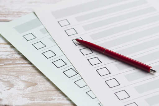 Ballot with checkboxes and a pencil