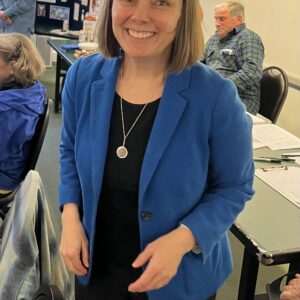 Secretary of State Shenna Bellows in her signature blue blazer
