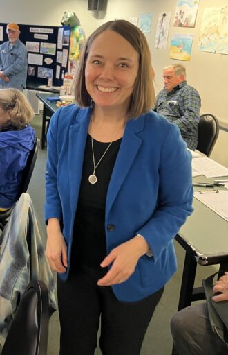 Secretary of State Shenna Bellows in her signature blue blazer