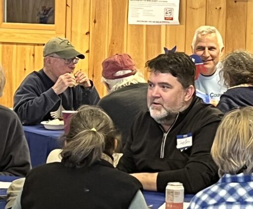 Senator Chip Curry and other local Democrats enjoy the potluck lunch