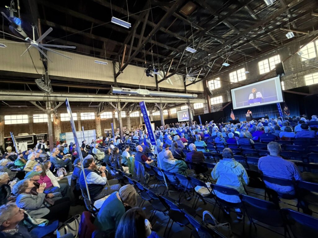 A view of the hundreds of delegates on the convention floor looking toward the stage.
