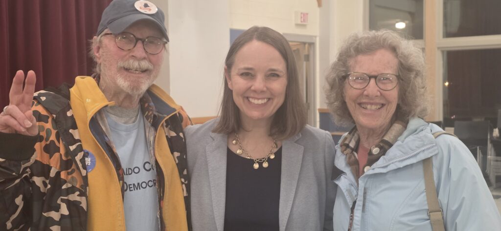 Secretary of State Shenna Bellows standing between WCDC members Jeff Smith and Betsy Hadley.