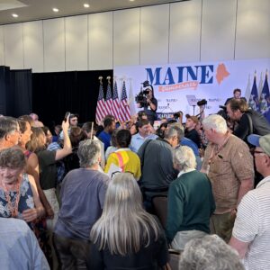 Scene at the convention as delegates crowd around nominee Troy Jackson on the convention floor